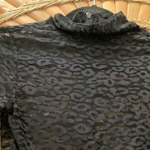 Never worn lace midriff top in black